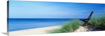 Michigan, Holland, beach chair overlooking Lake Michigan