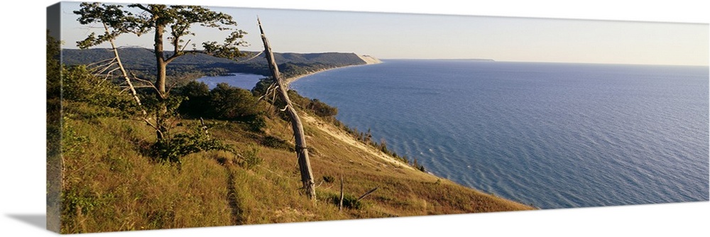 Panoramic photograph taken of a national park in Michigan with a vast view of Lake Michigan to the right and the coast of ...