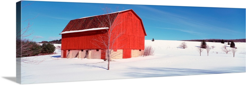 Michigan, View of a red stable on a snow covered farm