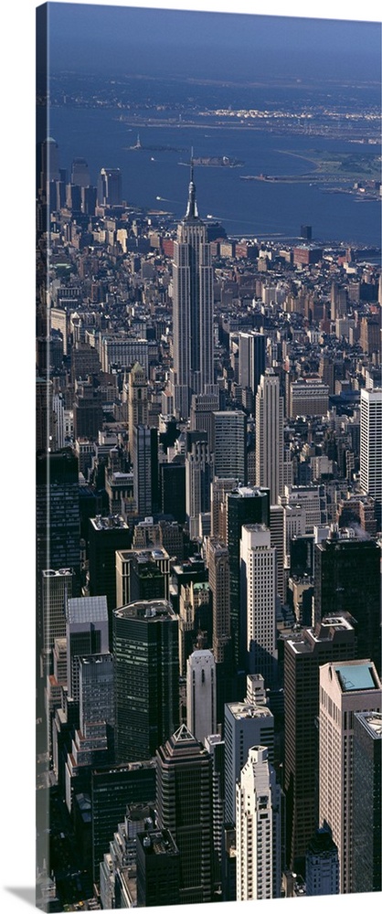 Skyscrapers in New York City are photographed from an aerial view and in vertical orientation.