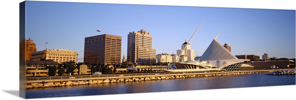Panoramic photograph on a big canvas of buildings on the water in Milwaukee, Wisconsin, including the Milwaukee Art Museum.