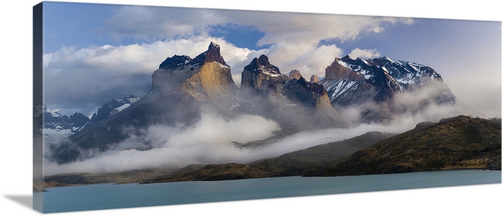 Morning clouds over the peaks of the Cuernos del Paine and Lake Pehoe, Torres Del Paine National Park, Chile.