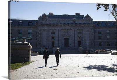 Naval cadets walking in front of a building, Tecumseh Court, US Naval Academy