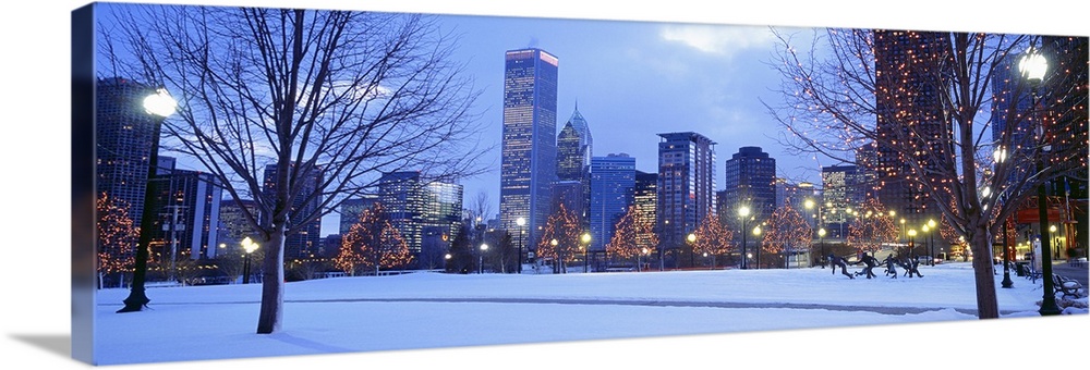 Panoramic photograph of the Navy Pier Park at dusk lit up for the holidays in Chicago, Illinois.