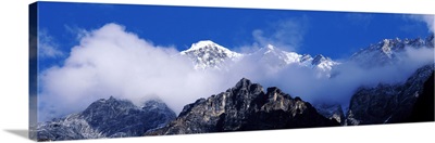 Nepal, Manaslu Trek, Low angle view of clouds around mountain peaks
