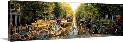 Netherlands, Amsterdam, bicycles on bridge over canal