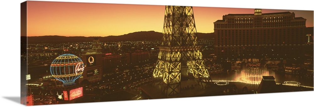 Panoramic photograph from a high angle of Las Vegas at night, including Paris, the Eiffel Tower and the Bellagio.