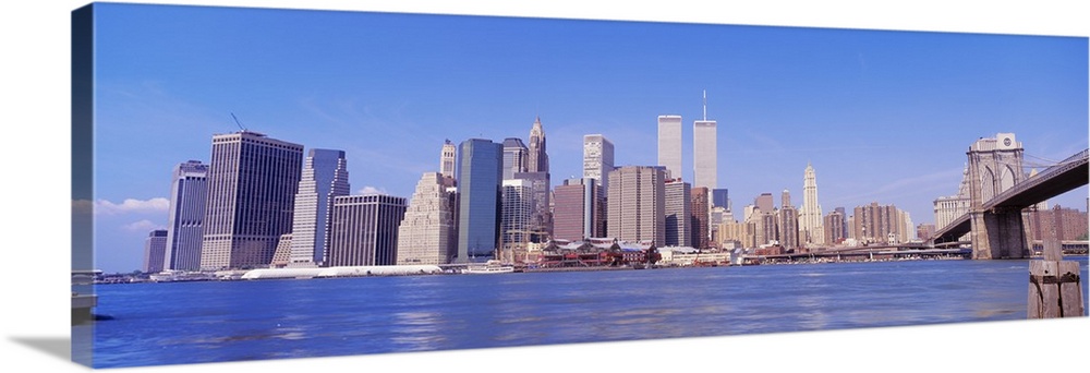Long panoramic photo of the NYC cityscape with the Twin Towers.