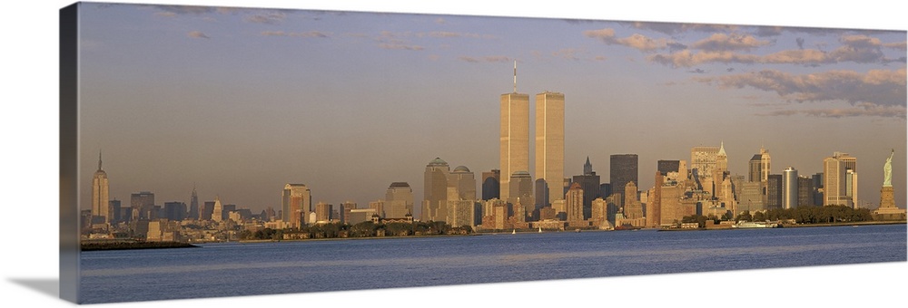 Panoramic image of the NYC skyline with the Twin Towers at sunset.