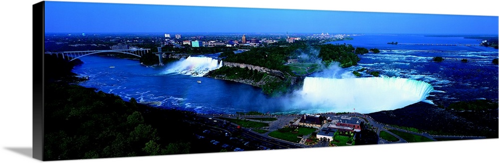 Aerial panoramic looking down at Niagra Falls and all the water spraying up in to the air with Ontario Canada in the backg...