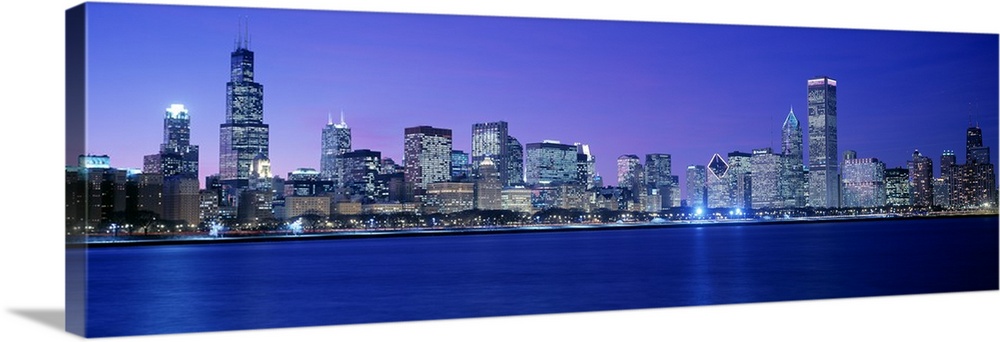 Panoramic photograph displays the lively skyline of this landmark city located within the Midwestern United States.  The b...