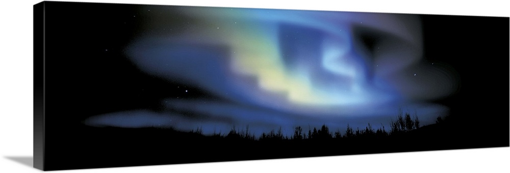 This large panoramic picture is taken of the northern lights with the sky and land below blacked out.