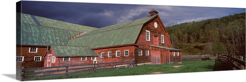 Old red barn with green rooftops in a farm, Vermont,