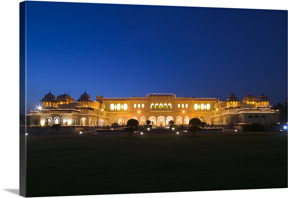 Palace lit up at dusk, Rambagh Palace, Jaipur, Rajasthan, India