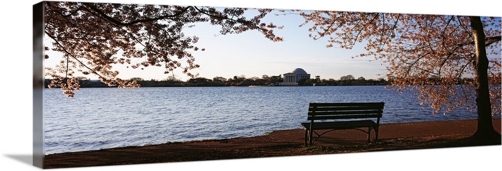 Park bench with a memorial in the background Jefferson Memorial Tidal Basin Potomac River Washington DC