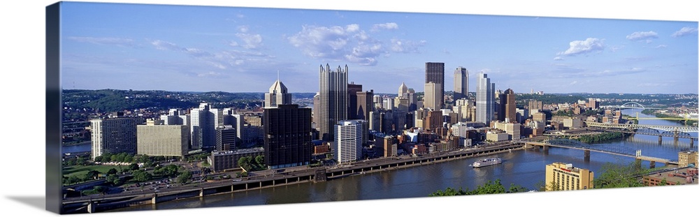 Long photo on canvas of the cityscape of Pittsburgh with a river running through it.