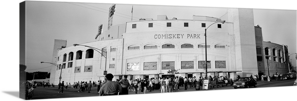 A crowd of people is shown as they enter the gates at Comiskey Park.
