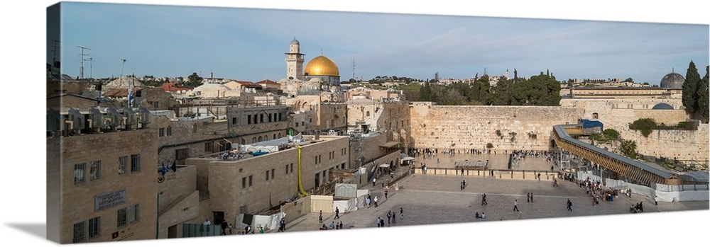 People praying at at Western Wall with Dome of the Rock and Al-Aqsa Mosque in the background, Old City, Jerusalem, Israel