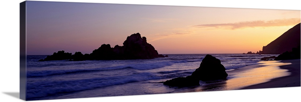Oversized, horizontal, panoramic photograph of the shoreline at Pfeiffer Beach in Big Sur, California.  Taken at sunset, w...
