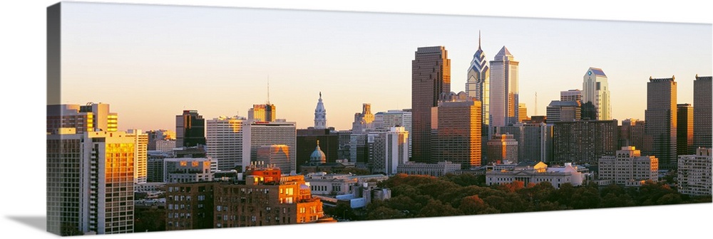 Giant, panoramic photograph of the sun shining on the skyline of Philadelphia.