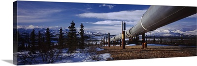 Pipeline passing through a snow covered landscape, Trans-Alaskan Pipeline, Alaska