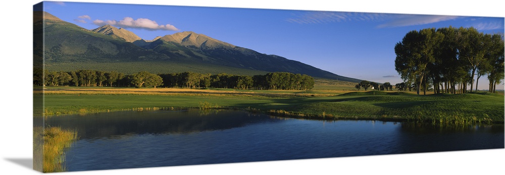 Pond in a golf course with mountains in the background, Former Great Sand Dunes Country Club, Great Sand Dunes National Mo...