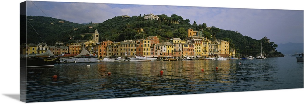 This is a panoramic photograph of the picturesque harbor taken from on the water.
