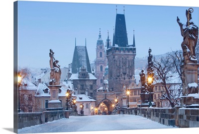 Prague, Charles Bridge tower and St. Nicolas church on winter morning