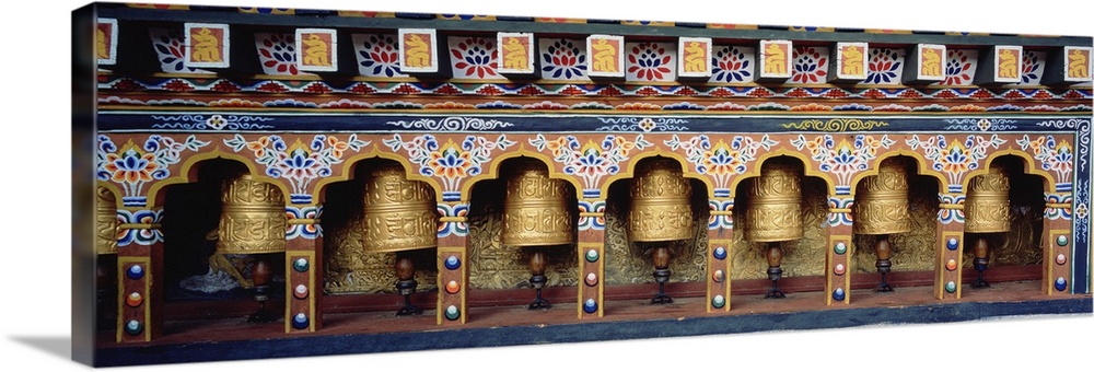 Prayer wheels in a temple, Chimi Lhakhang, Punakha, Bhutan