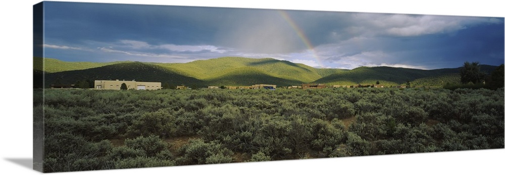 Rainbow over a rolling landscape, Taos, New Mexico