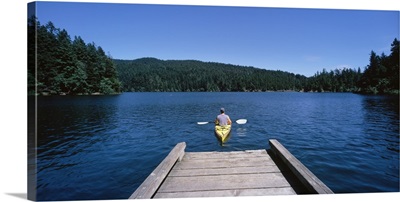 Rear view of a man on a kayak in a river, Orcas Island, Washington State