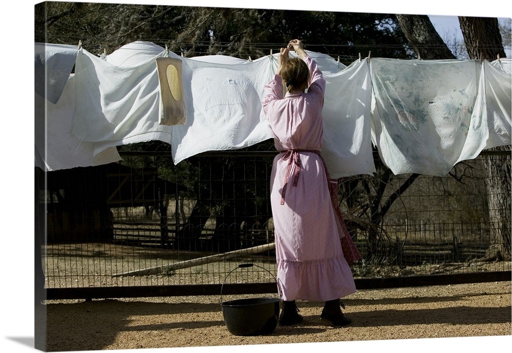 Rear view of a woman drying clothes on a clothesline, Lyndon B. Johnson