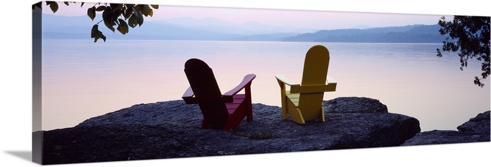 Red And Yellow Adirondack Chairs On A Rock Near A Lake Champlain Lake Vermont