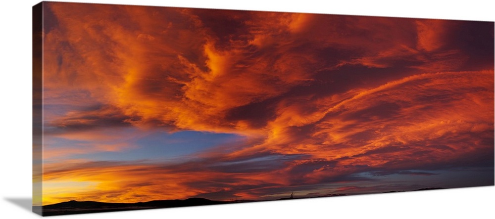 Red dramatic sky during sunset, Taos, Taos County, New Mexico, USA.