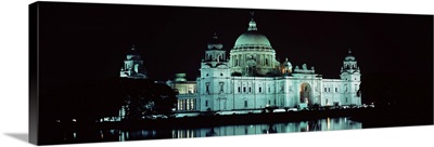 Reflection of a palace in water at night, Victoria Memorial, Kolkata, West Bengal, India
