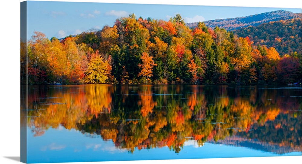 Reflection of autumn trees in a lake, West Bolton, Quebec, Canada