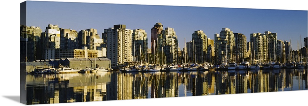 Reflection of buildings in water, False Creek, Granville Island, Vancouver, British Columbia, Canada