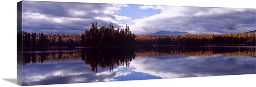Reflection of clouds and trees in water, Little Bitterroot Lake, Montana