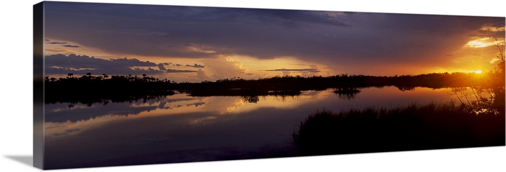 Reflection of clouds in a river, Everglades National Park, Florida,