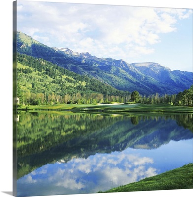 Reflection of clouds on water, Teton Pines Golf Course, Jackson, Wyoming
