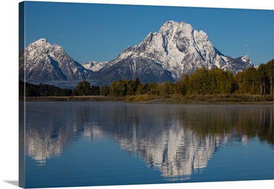 Reflection of mountain and trees on water, Grand Teton National Park, Wyoming