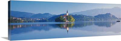 Reflection of mountains and buildings in water, Lake Bled, Slovenia