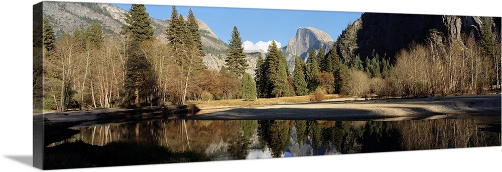 Reflection of mountains and trees in a lake, Half dome, Yosemite National Park, California