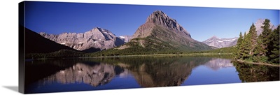 Reflection of mountains in a lake, Swiftcurrent Lake, Many Glacier, US Glacier National Park, Montana,