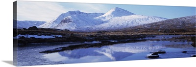Reflection of snow covered mountains in a lake, Black Mount, Lochan Na h'Achlaise, Rannoch Moor, Highlands Region, Scotland