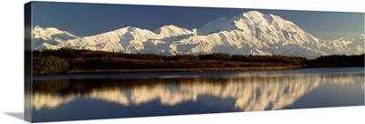 Reflection of snow covered Mt McKinley in water, Denali National Park, Alaska