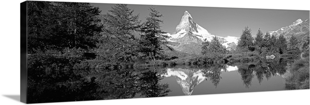 Reflection of trees and mountain in a lake, Matterhorn, Switzerland