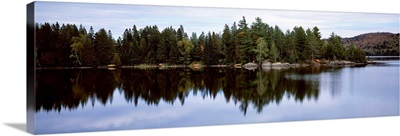 Reflection of trees on water in a lake, Lake Of Two Rivers, Ontario, Canada