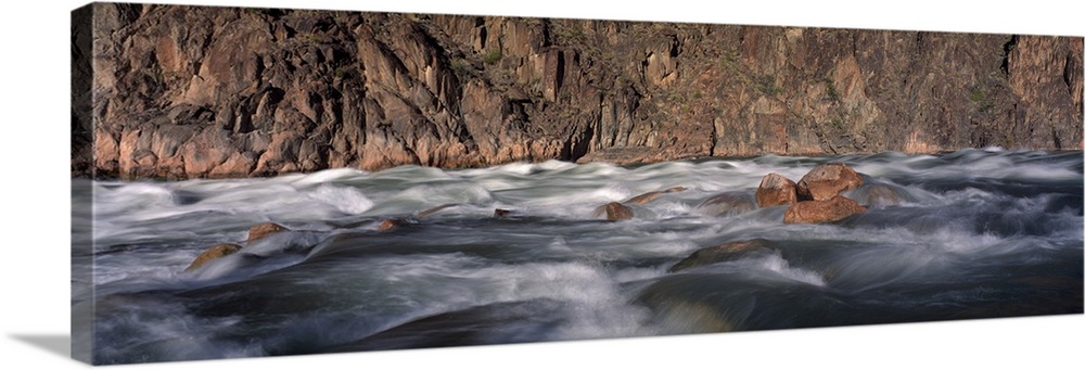 Panoramic image of the rushing Colorado River rapids at the Grand Canyon in Arizona.