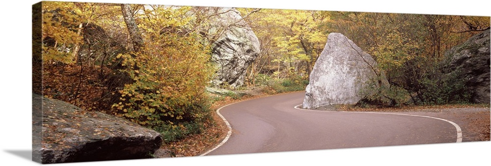Road curving around a big boulder, Stowe, Lamoille County, Vermont,